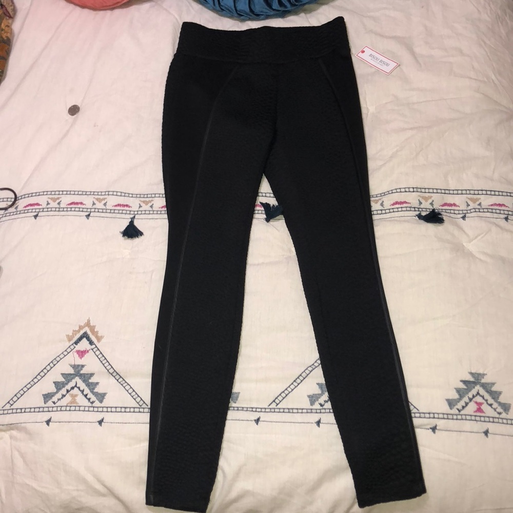 Black leggings with black snakeskin-like print